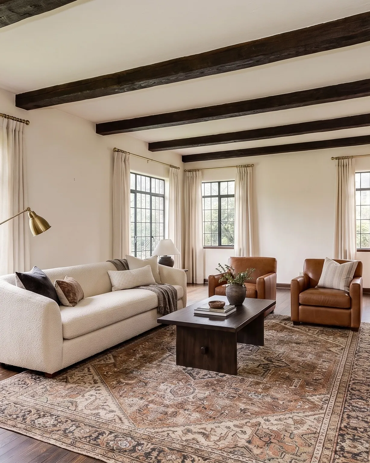 Tudor living room with a cream sofa and a brick fireplace